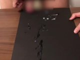 Selfie masturbation mass ejaculation on black paper. Please see the amount and thick sperm.