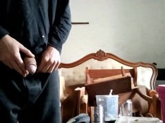 man in black pissing
