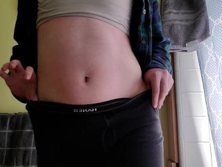 Trans guy scratching his torso