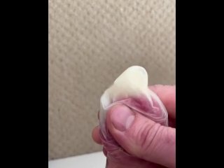 Jerking a load in condom