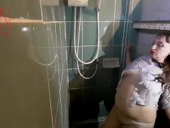 Nice lady in the shower in wet clothes and a hat. Striptease dancing in the shower. FULL