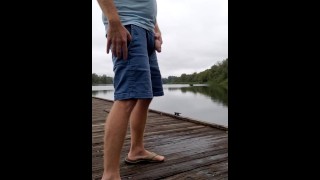 Redbull piss outside at the river, on the dock