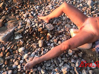 pissing lying on the seashore