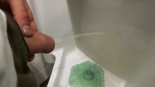 peeing at urinal