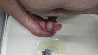 Pissing into the sink and into the foreskin