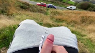 TEEN CUMMING ON THE ROAD SIDE AS CARS DRIVE BY