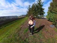 Crossdresser flashing huge boobs near train station