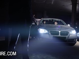 Gangbang with a busty brunette in a parking