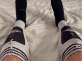 Macrophilia - tiny people hide in giants football socks
