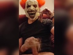 Evil Clown strokes massive cock