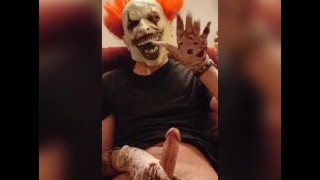 Evil Clown strokes massive cock