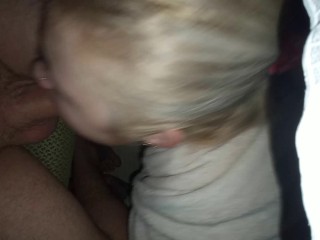The girl decided to suck while the guy is playing the computer