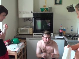 First Melady and Lea humiliate their slave Joschi by spitting him with leftovers.