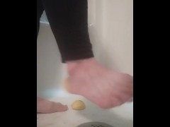 Steps on lemons in shower