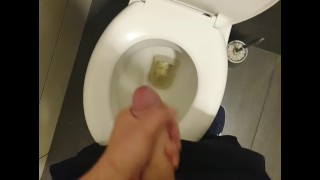 Young man masturbatets in bathroom.