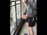 Skinny exhibitionist shows boner on public Toronto balcony while smoking