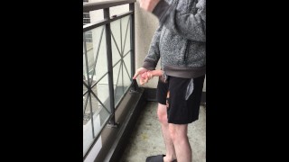 While Smoking On A Public Toronto Balcony A Skinny Exhibitionist Displays Her Boner