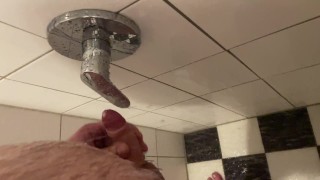 Fat guy with a small cock jerking in the shower and cumshot on a water tap