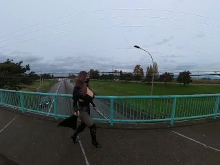 Crossdresser flashing on a highway bridge