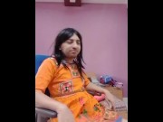 Indian crossdresser in a traditional red embroidery dress.