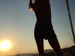 dancing at sunset barefoot bare chest to the sun