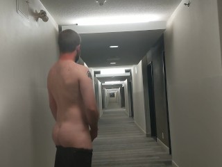 Cumming in Hotel Hallway