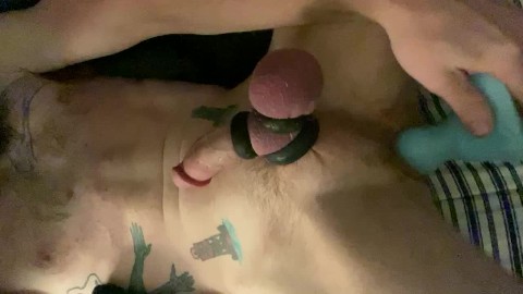 Collared young guy rides his big knot while stroking his cock