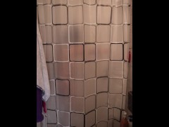 Horny girl dance while she undressed behind the shower curtain