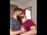 Two men kissing