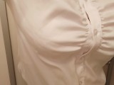 bra is seen through the blouse