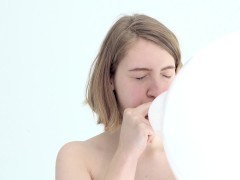 looner babe blowing and popping her first balloon