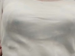 Crossdresser, light blue bra is seen through the camisole.