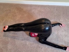 Latex Yoga - Sexy small rubber doll stretches and flexes her latex catsuit in different yoga poses