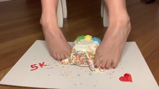 Crushing cake with feet 