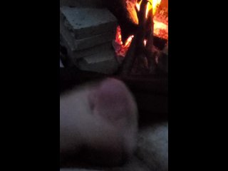 Blasting cum in front of a fire