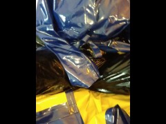 Solo masturbation in PVC raincoat and latex