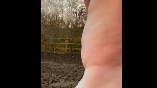 Naked barefoot muddy field