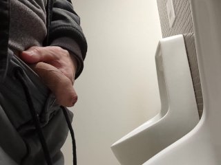 guy piss at public toilet