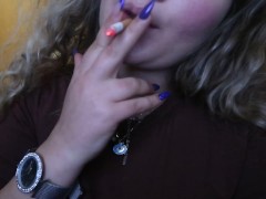 CLOSE UP CIGAR SMOKE BY A SEXY BLONDE WOMAN