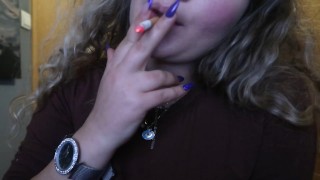 CLOSE UP CIGAR SMOKE BY A SEXY BLONDE WOMAN
