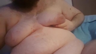 Chubby plays with his fat tits