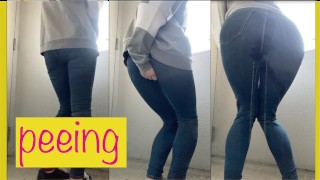 OL In Jeans Standing In Front Of A Public Restroom Desperate For A Pee
