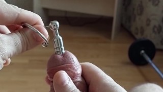 Cumshot through penis urethral plug with glans ring (slow motion cumshot)