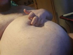 Chubby plays with his bellybutton