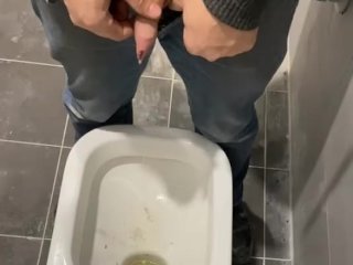 Man Peeing in Toilet