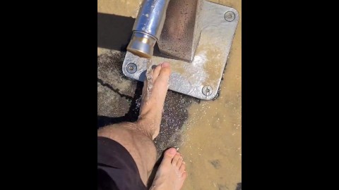 FTM hairy bare feet wandering through public beach & getting cleaned 