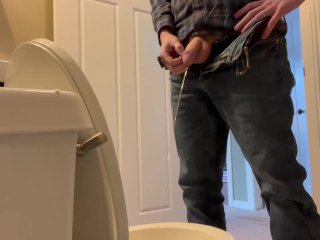 Candid shot of guy Pissing.