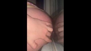 Fucking dildo against open window 