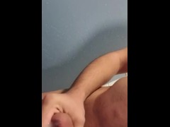 Young man masturbating in changing room