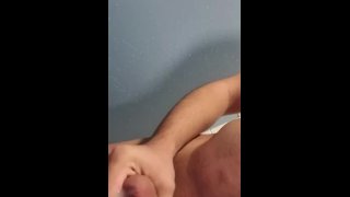 Young man masturbating in changing room